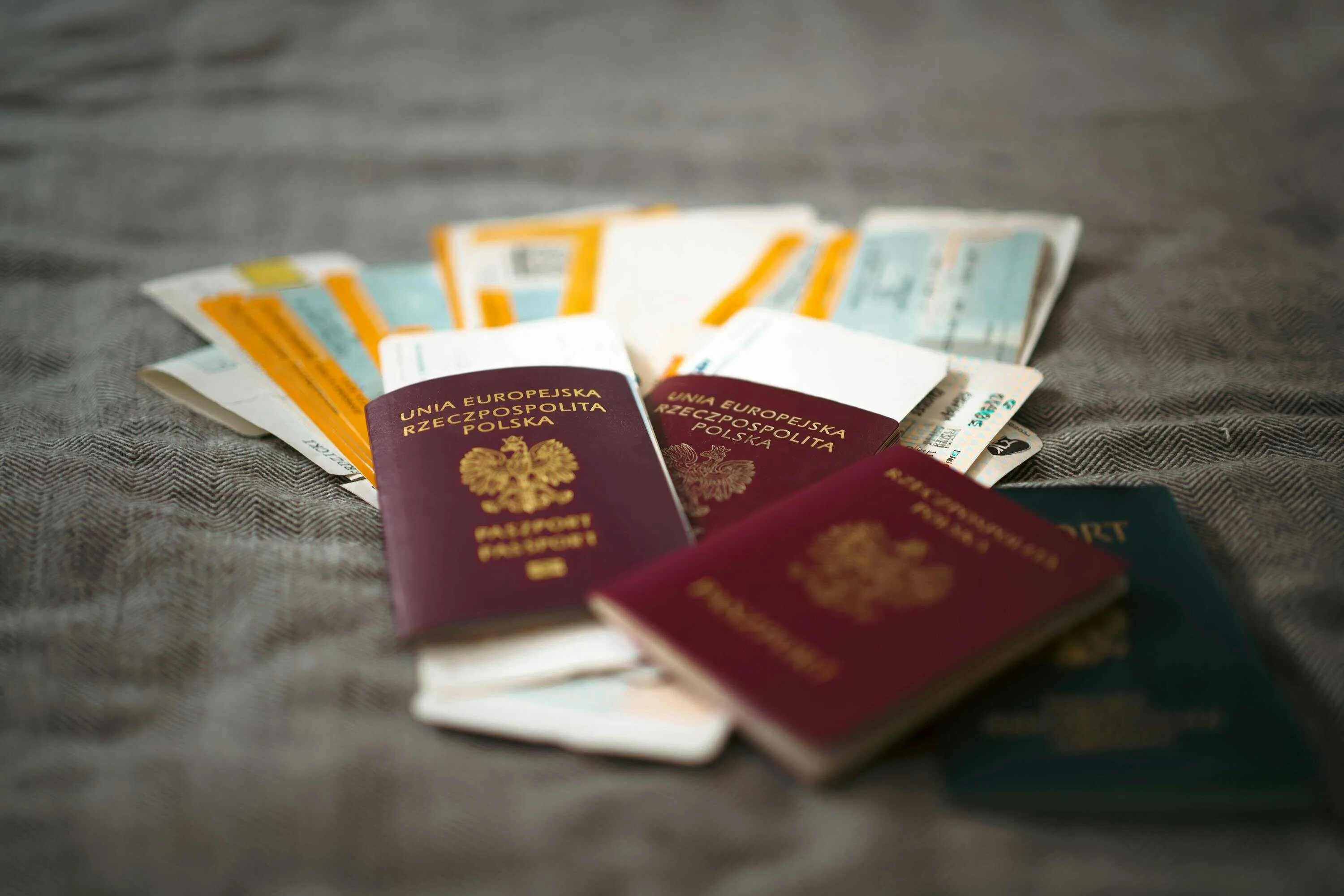 European passports lying on top of international banknotes