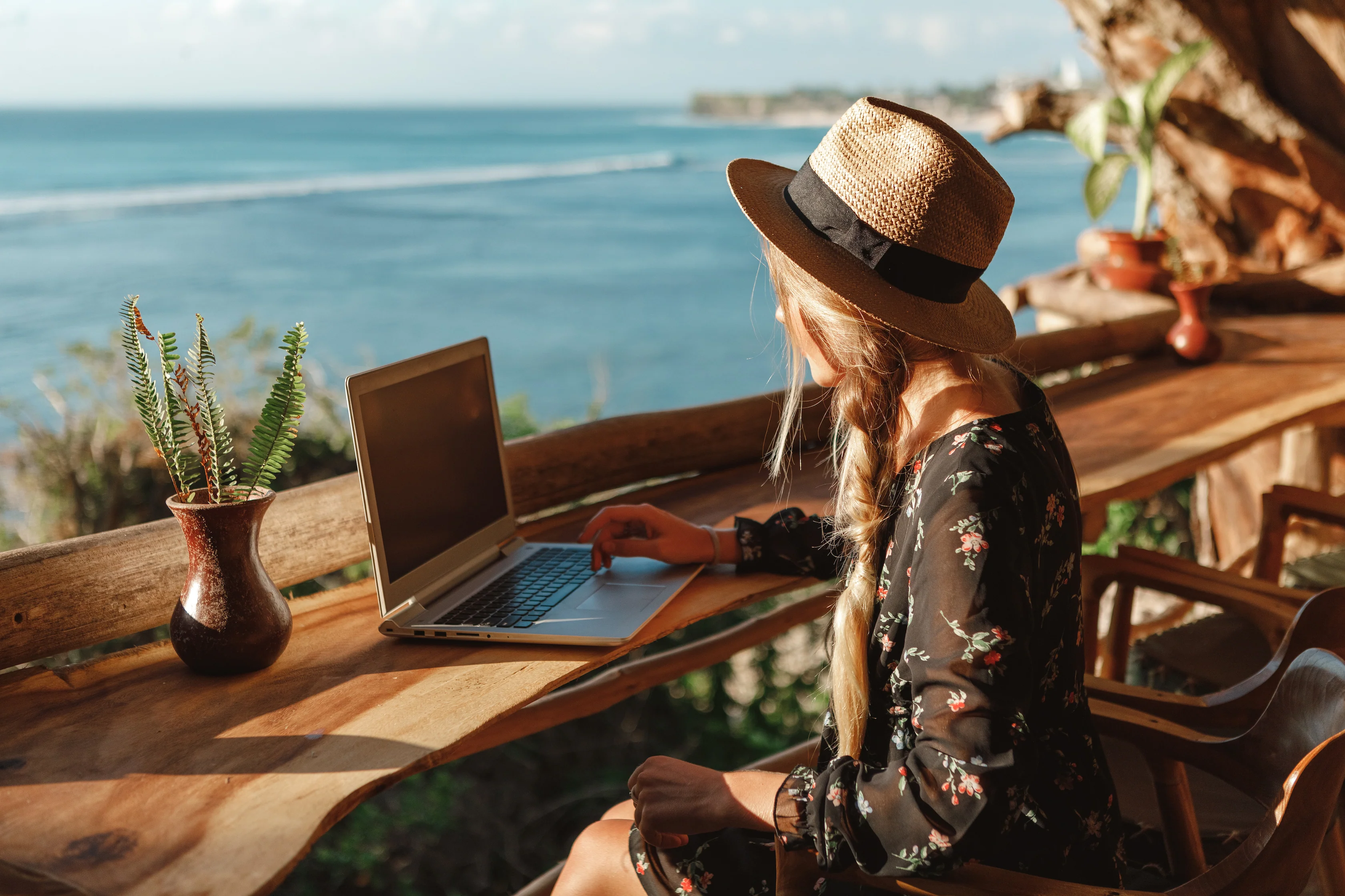 Digital nomad working remotely and managing travel documents